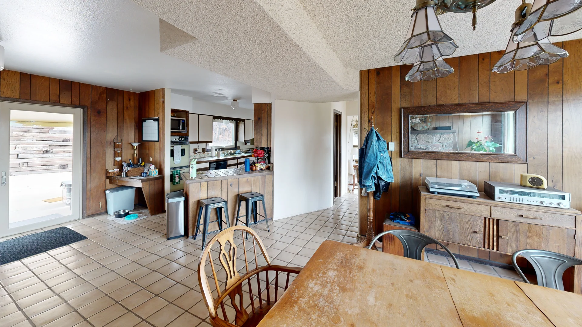 3D scan of a kitchen and dining area with wood paneling